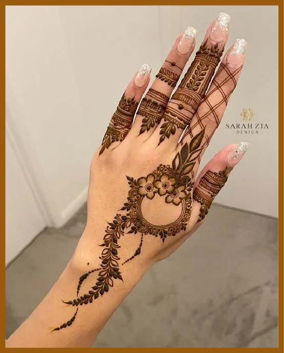 Aesthetic Mehndi On Back Hand With Leaf And Bud Trail